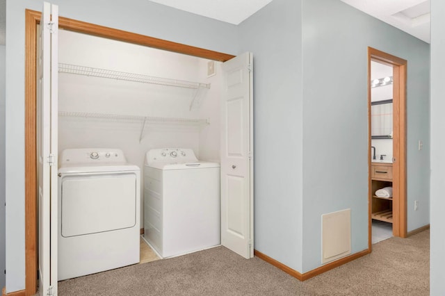 5055 149th St N Unit 2, Hugo, MN 55038 - laundry area featuring carpet floors and washer and clothes dryer