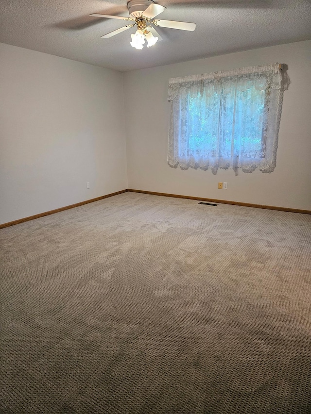 2705 9th St SW, Willmar, MN 56201 - unfurnished room with a ceiling fan, carpet flooring, and a textured ceiling