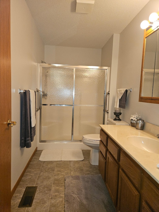 2705 9th St SW, Willmar, MN 56201 - bathroom featuring vanity, a stall shower, a textured ceiling, and tile patterned flooring