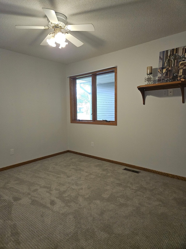 2705 9th St SW, Willmar, MN 56201 - empty room featuring a ceiling fan and carpet