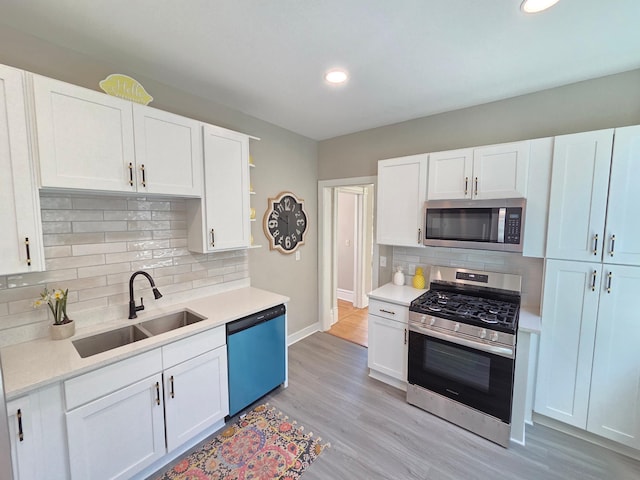 1323 Lincoln Ave, Saint Paul, MN 55105 - kitchen with appliances with stainless steel finishes, a sink, backsplash, open shelves, and light countertops