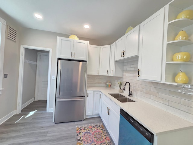 1323 Lincoln Ave, Saint Paul, MN 55105 - kitchen featuring freestanding refrigerator, dishwasher, a sink, open shelves, and white cabinetry