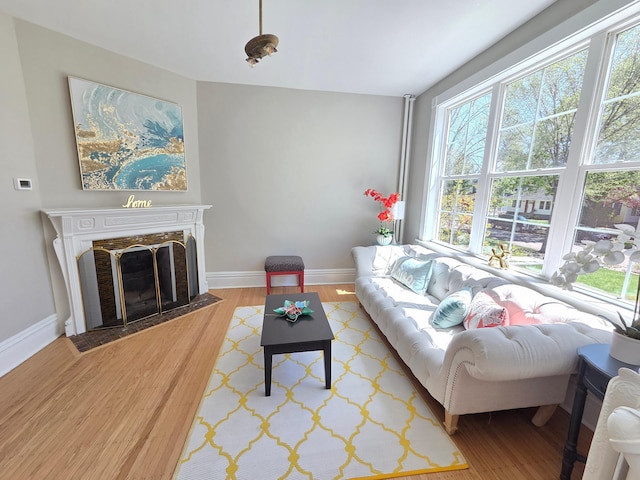 1323 Lincoln Ave, Saint Paul, MN 55105 - living area featuring light wood finished floors, baseboards, and a premium fireplace
