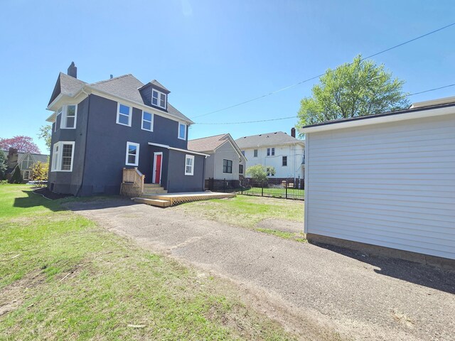 1323 Lincoln Ave, Saint Paul, MN 55105 - view of front of home featuring a chimney and stucco siding