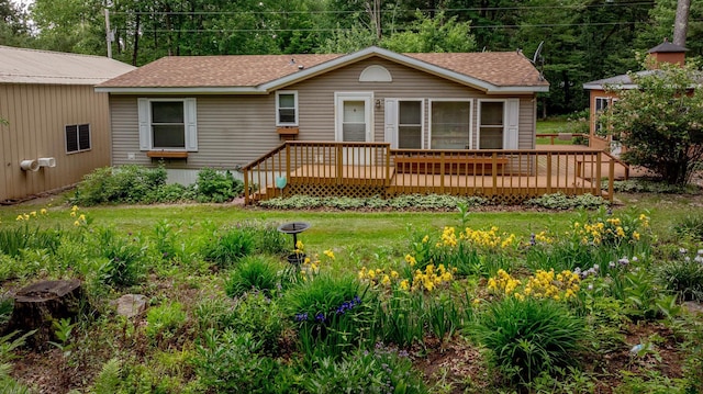 33087 Elm Ln, Motley, MN 56466 - rear view of property with a deck, roof with shingles, and a lawn