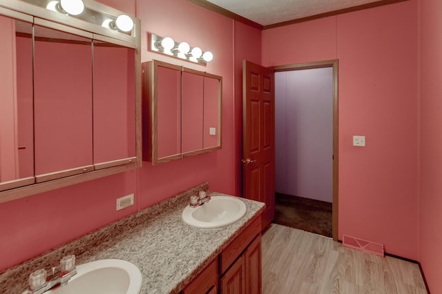 33087 Elm Ln, Motley, MN 56466 - full bath with wood finished floors, double vanity, and crown molding