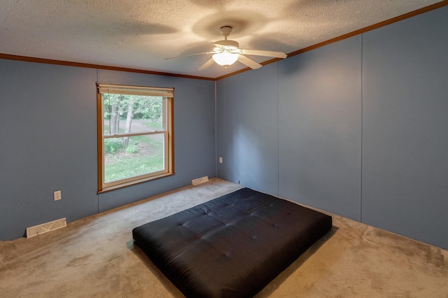 33087 Elm Ln, Motley, MN 56466 - unfurnished bedroom featuring crown molding, carpet floors, a textured ceiling, and a ceiling fan