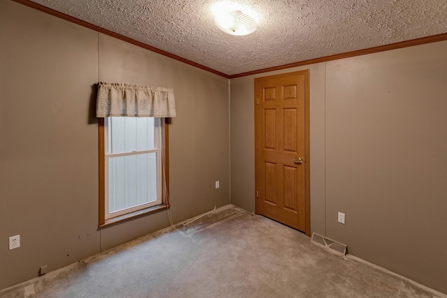 33087 Elm Ln, Motley, MN 56466 - carpeted spare room featuring crown molding and a textured ceiling
