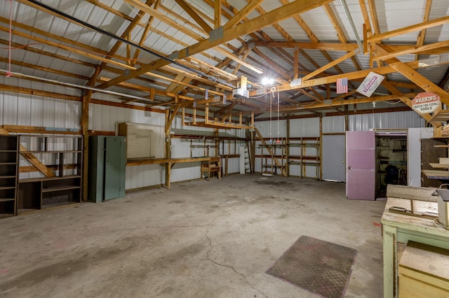 33087 Elm Ln, Motley, MN 56466 - garage featuring a garage door opener and metal wall