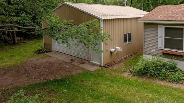 33087 Elm Ln, Motley, MN 56466 - view of side of property with an outdoor structure, a lawn, a metal roof, and a detached garage