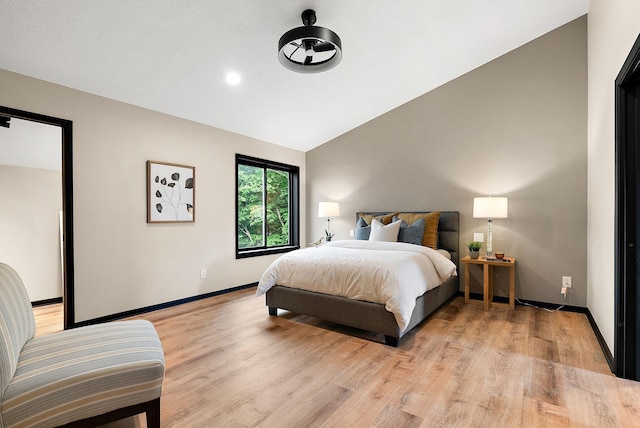 8335 Virginia Ave S, Bloomington, MN 55438 - bedroom featuring light wood-style flooring and vaulted ceiling