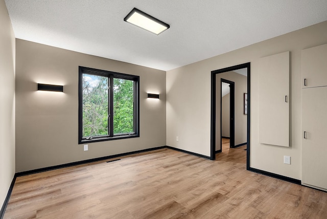 8335 Virginia Ave S, Bloomington, MN 55438 - spare room with light wood finished floors and baseboards