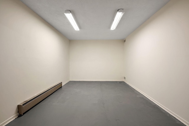 8335 Virginia Ave S, Bloomington, MN 55438 - spare room with a baseboard radiator and concrete flooring