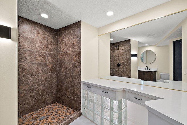 8335 Virginia Ave S, Bloomington, MN 55438 - full bathroom featuring a walk in shower, vanity, recessed lighting, a textured ceiling, and tile patterned flooring