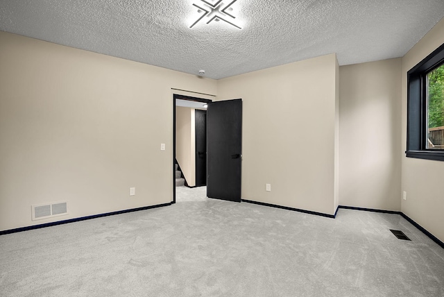 8335 Virginia Ave S, Bloomington, MN 55438 - unfurnished room with a textured ceiling and carpet flooring