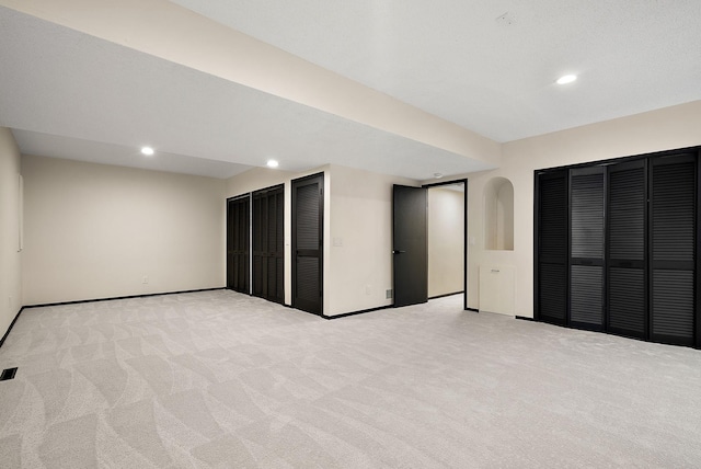 8335 Virginia Ave S, Bloomington, MN 55438 - below grade area featuring light colored carpet and recessed lighting