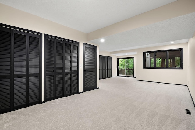 8335 Virginia Ave S, Bloomington, MN 55438 - unfurnished living room with carpet floors and recessed lighting