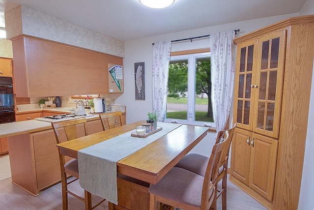 905 24th Ave N, Saint Cloud, MN 56303 - dining area featuring light wood-style floors and french doors