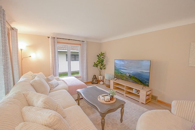 905 24th Ave N, Saint Cloud, MN 56303 - living room featuring light wood-style flooring and baseboards