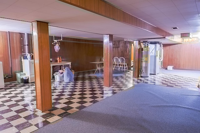 905 24th Ave N, Saint Cloud, MN 56303 - finished basement featuring tile patterned floors, water heater, wood walls, and a drop ceiling