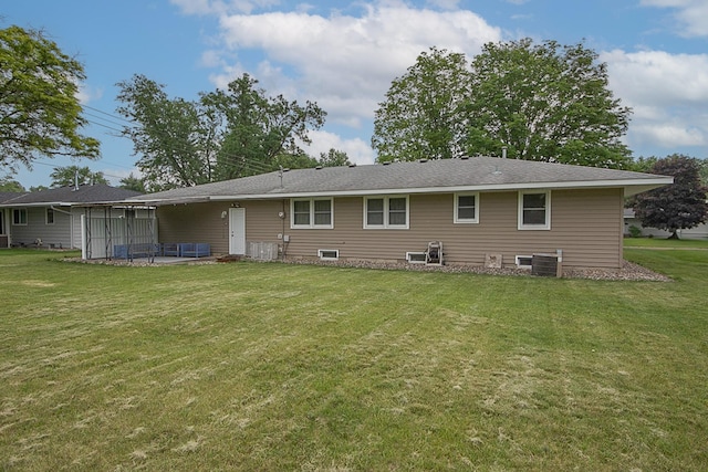 905 24th Ave N, Saint Cloud, MN 56303 - rear view of house featuring a lawn and a sunroom