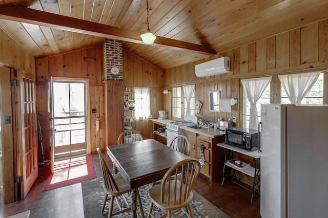 7520 Trophy Trl NW, Walker, MN 56484 - dining space with a wall unit AC, dark wood-style floors, healthy amount of natural light, wood walls, and wood ceiling