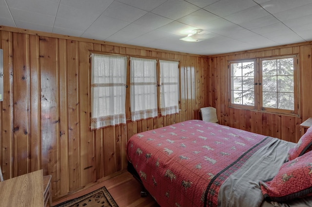 7520 Trophy Trl NW, Walker, MN 56484 - bedroom with wooden walls and wood finished floors
