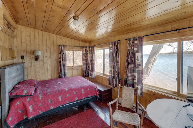 7520 Trophy Trl NW, Walker, MN 56484 - bedroom with wooden walls, wood finished floors, wooden ceiling, a water view, and vaulted ceiling