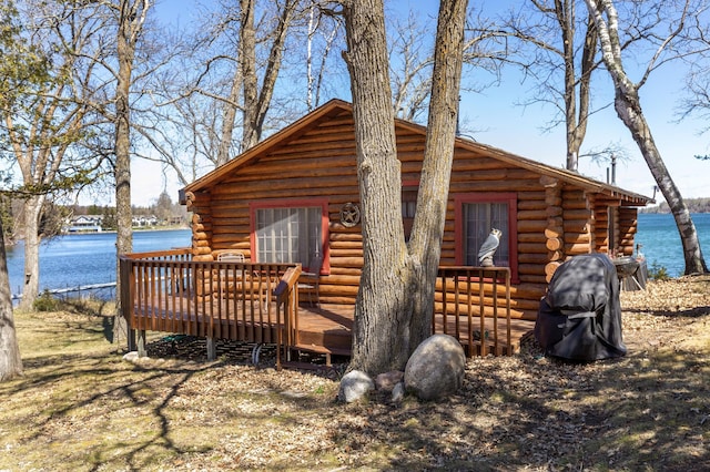 7520 Trophy Trl NW, Walker, MN 56484 - view of property exterior featuring log siding and a deck with water view