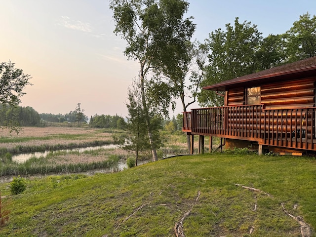7520 Trophy Trl NW, Walker, MN 56484 - yard at dusk with a deck and a yard