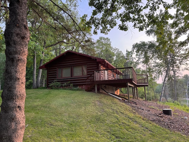 7520 Trophy Trl NW, Walker, MN 56484 - back of house with a wooden deck and a lawn