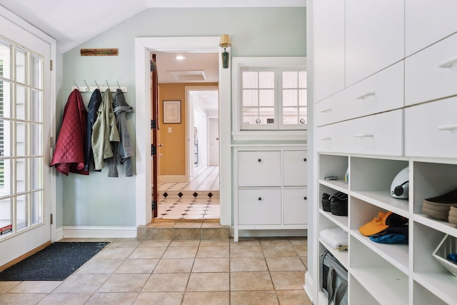 11155 Mill Run, Minnetonka, MN 55305 - walk in closet featuring vaulted ceiling and light tile patterned floors