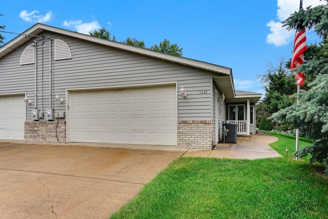 5645 Wisconsin Ave N, New Hope, MN 55428 - view of property exterior featuring brick siding and a lawn