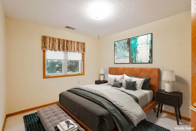 5645 Wisconsin Ave N, New Hope, MN 55428 - carpeted bedroom with a textured ceiling and baseboards