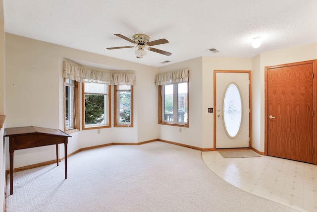 5645 Wisconsin Ave N, New Hope, MN 55428 - carpeted entrance foyer with ceiling fan and baseboards