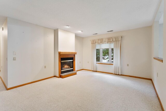 5645 Wisconsin Ave N, New Hope, MN 55428 - unfurnished living room featuring carpet and a glass covered fireplace