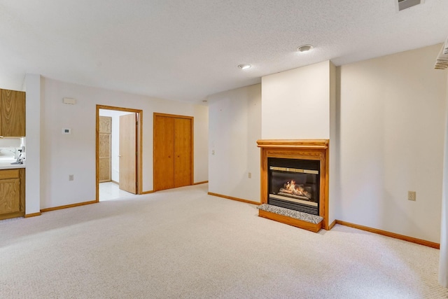 5645 Wisconsin Ave N, New Hope, MN 55428 - unfurnished living room featuring a glass covered fireplace and light colored carpet