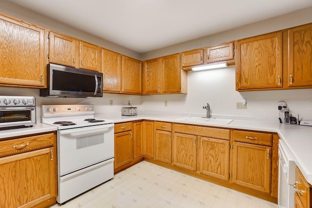 5645 Wisconsin Ave N, New Hope, MN 55428 - kitchen with white appliances, light countertops, and light flooring