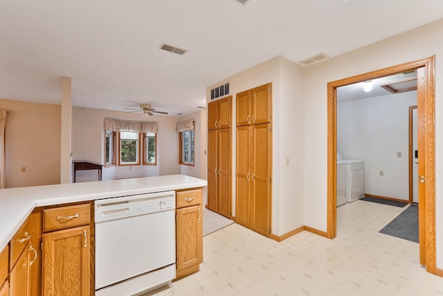 5645 Wisconsin Ave N, New Hope, MN 55428 - kitchen featuring white dishwasher, washer and dryer, light flooring, light countertops, and ceiling fan
