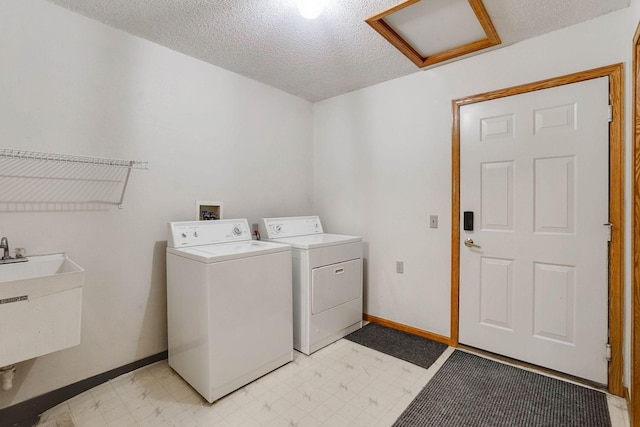5645 Wisconsin Ave N, New Hope, MN 55428 - laundry area with attic access, washer and dryer, light flooring, and a textured ceiling
