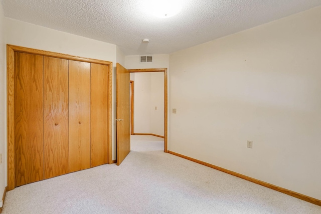 5645 Wisconsin Ave N, New Hope, MN 55428 - unfurnished bedroom with carpet flooring, a closet, and a textured ceiling