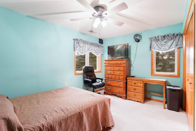 5645 Wisconsin Ave N, New Hope, MN 55428 - bedroom with carpet floors, a ceiling fan, and a textured ceiling