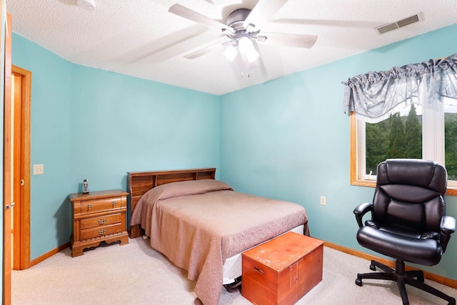 5645 Wisconsin Ave N, New Hope, MN 55428 - bedroom with carpet flooring, a textured ceiling, and a ceiling fan