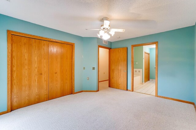 5645 Wisconsin Ave N, New Hope, MN 55428 - unfurnished bedroom with carpet floors, a closet, ensuite bath, and a ceiling fan