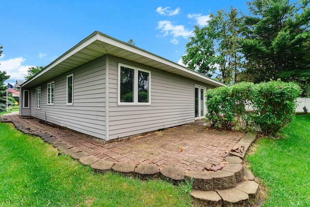 5645 Wisconsin Ave N, New Hope, MN 55428 - view of side of property with a yard and a patio