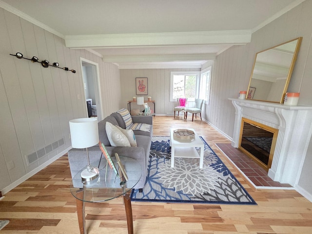 13801 Lake Street Ext, Minnetonka, MN 55345 - living area with wood finished floors, crown molding, beamed ceiling, a tiled fireplace, and baseboards