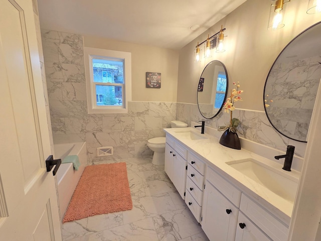13801 Lake Street Ext, Minnetonka, MN 55345 - full bathroom featuring marble finish floors, tile walls, double vanity, a bath, and toilet