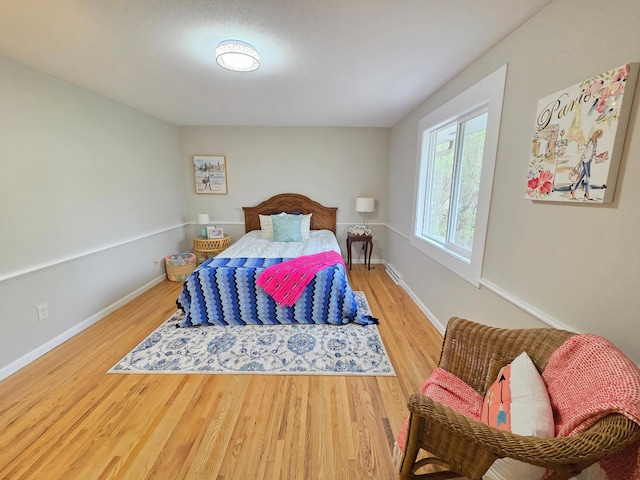 13801 Lake Street Ext, Minnetonka, MN 55345 - bedroom featuring wood finished floors and baseboards