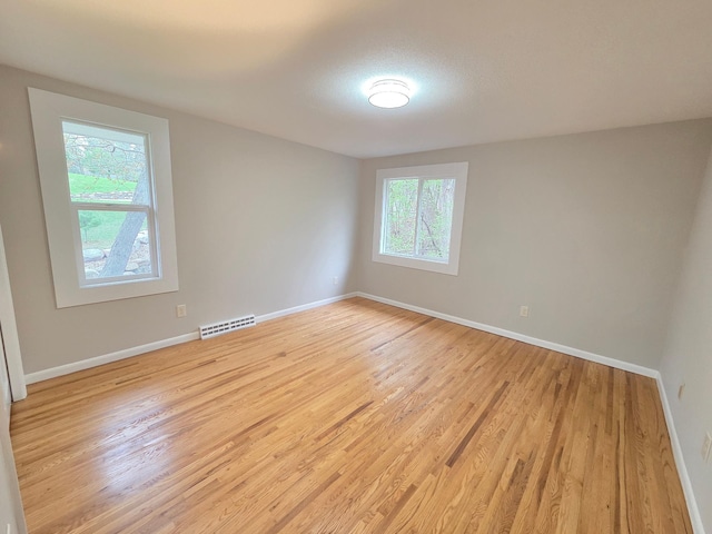 13801 Lake Street Ext, Minnetonka, MN 55345 - empty room with light wood-style floors and baseboards