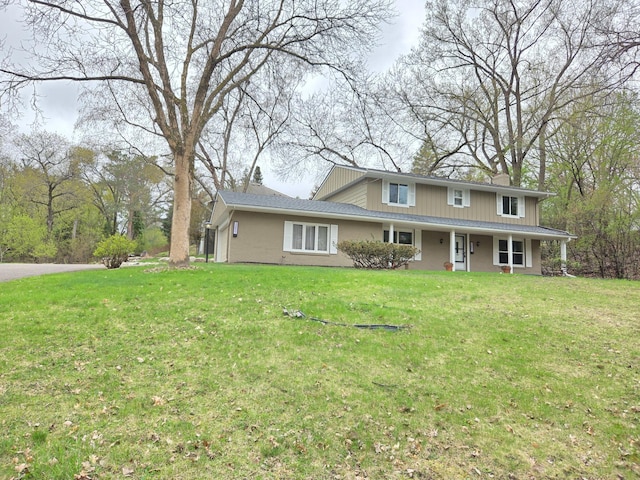 13801 Lake Street Ext, Minnetonka, MN 55345 - traditional-style home featuring a chimney, a front lawn, and a porch